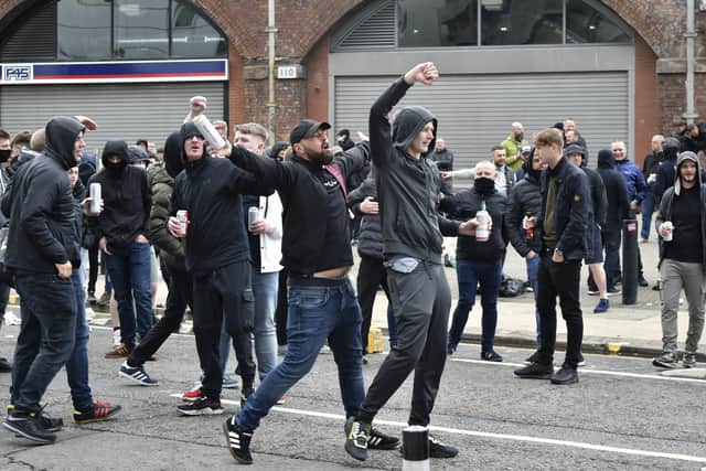 Manchester United fans protest outside the Lowry Hotel where team was staying during a protest against the Glazer family, owners of Manchester United, before their Premier League match against Liverpool at Old Trafford. Picture: AP/Rui Vieira.
