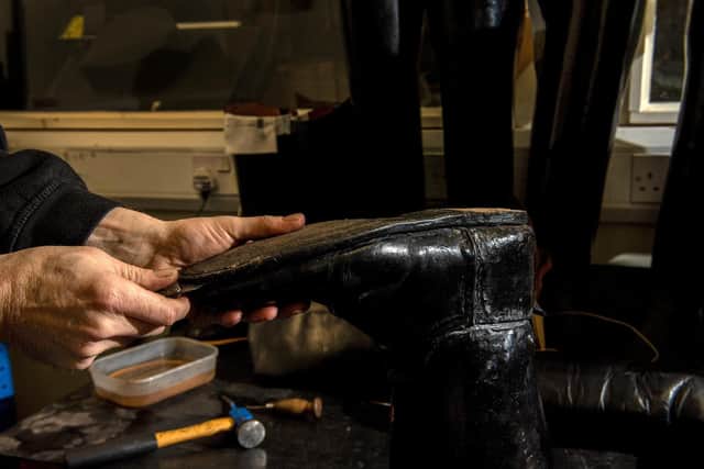 Work on a boot at The Boot Repair Company in Leeds, a fourth generation company. (Bruce Rollinson).