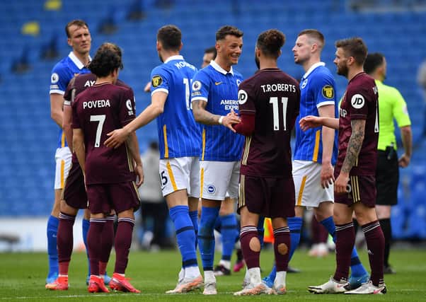 Hard luck: Brighton defender Ben White, who spent last season on loan at Leeds United, shakes hands with Tyler Roberts after the Seagulls' 2-0 win. (Photo by Ben Stansall - Pool/Getty Images)