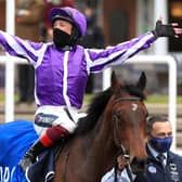 Frankie Dettori celebrates the Qipco 1000 Guineas win of Mother Earth.