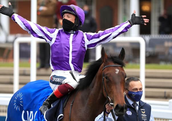 Frankie Dettori celebrates the Qipco 1000 Guineas win of Mother Earth.