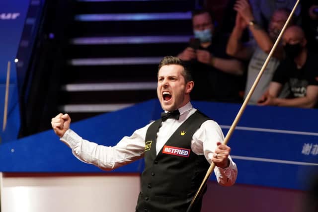 England's Mark Selby celebrates his victory.