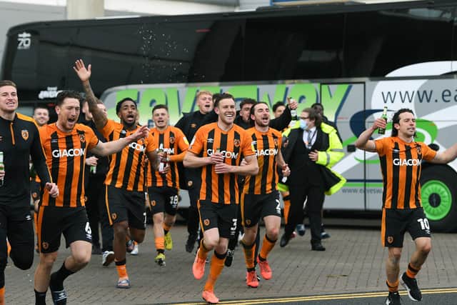 Hull' City players run to celebrate with their fans outside the KCOM Stadium after they became champions (
Picture: Jonathan Gawthorpe)