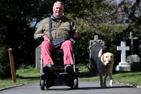 Andrew Newton and his service dog, Alvin, outside St John's Church in Sharrow where his wife is the vicar.
