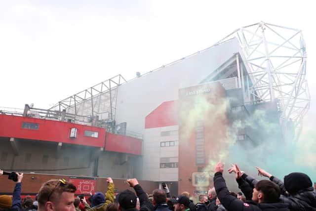 Fans let off flares as they protest against the Glazer family, owners of Manchester United, before their Premier League match against Liverpool at Old Trafford, Manchester.(Picture: Barrington Coombs/PA Wire)