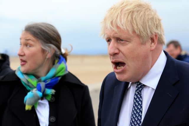 Prime Minister Boris Johnson (right) reacts as he campaigns on behalf of Conservative Party candidate Jill Mortimer in Hartlepool.