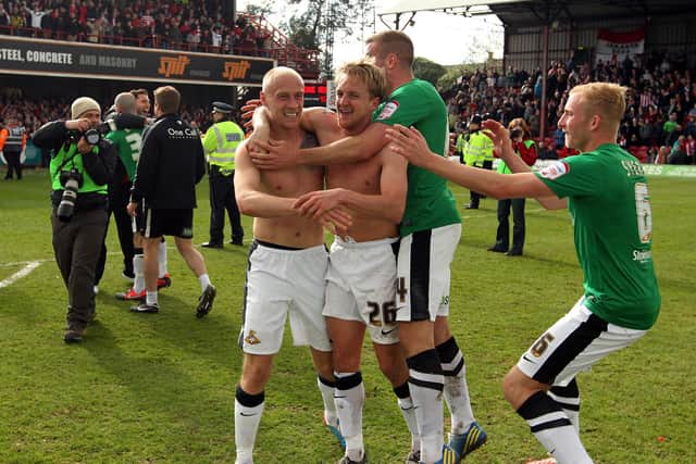 Last-gasp: Doncaster scorer James Coppinger celebrates his side winning the title at Griffin Park, Brentford.