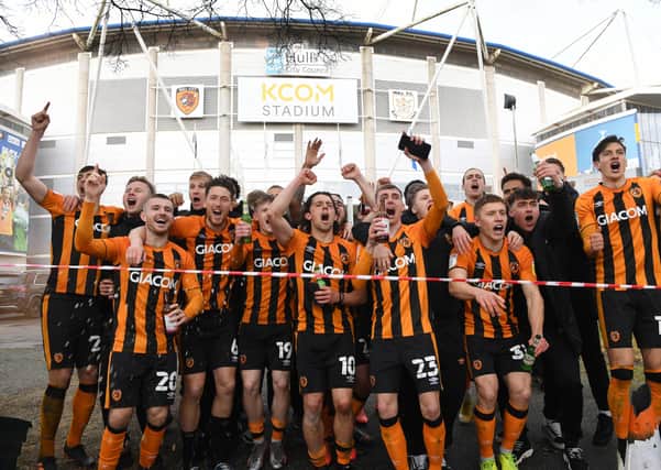 Just champion: Hull City players run out to celebrate outside the KCOM Stadium with their fans, after becoming champions. Picture : Jonathan Gawthorpe