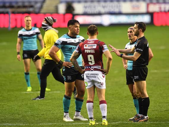 Hull FC's Andre Savelio, left, makes his complaint to referee James Child with Wigan captain Sam Powell and Hull skipper Danny Houghton present. (JONATHAN GAWTHORPE)