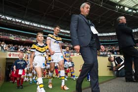 Daryl Powell leads his Castleford Tigers team out with captain Michael Shenton ahead of the 2014  Challenge Cup final against Leeds Rhinos at Wembley. (ALLAN MCKENZIE/SWPIX)