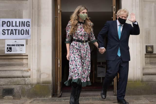 Prime Minister Boris Johnson and his fiancee Carrie Symonds leave after casting their vote at Methodist Central Hall, central London, in the local and London Mayoral election.