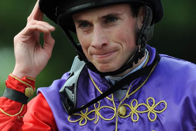 Ryan Moore acknowledges the crowds after Carlton House's Dante win.