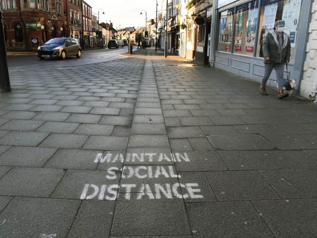 A painted message in Selby which urges people to maintain social distancing