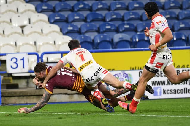 Try: Chris McQueen scores for Giants in their 18-10 loss to St Helens. 
Picture: Jonathan Gawthorpe