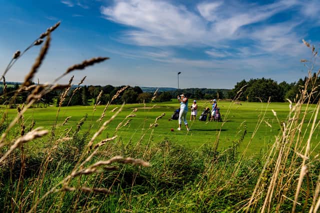 A group of ladies teeing off on the seventh whilst playing a round of golf at Headingley Golf Club, Leeds, under a rich blue sky (Picture: James Hardisty)