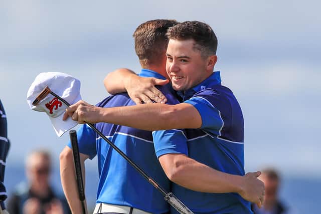 Alex Fitzpatrick and Conor Purcell embrace after scoring the first point of the day beating USA during day one of the 2019 Walker Cup at Royal Liverpool Golf Club, Hoylake. (Picture: PA)