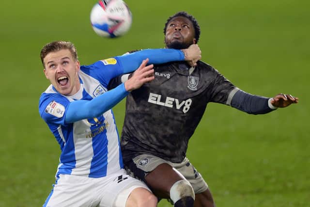 Huddersfield Town's Danny Ward battles with Sheffield Wednesday's Dominic Iorfa. Picture: Steve Ellis
