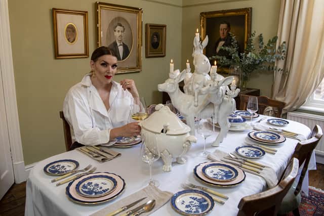 Rosie at her dining table. The plates are vintage finds while the aninal statue and the tureen both come from Anthropologie. Picture Tony Johnson