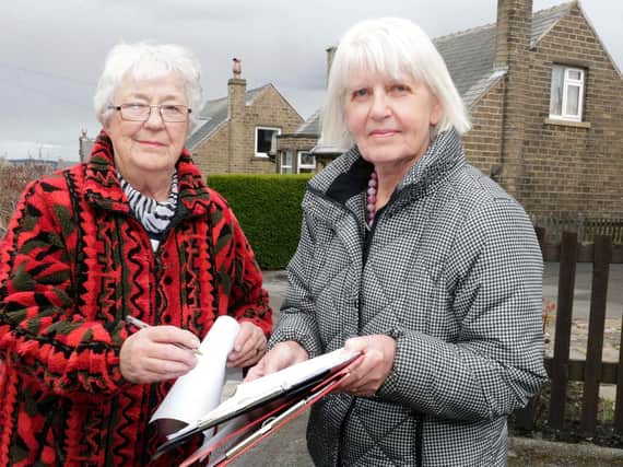 Lesley Lambourne (right) has the petition signed by Crosland Moor resident Shirley Landin. (Image: Andy Catchpool)