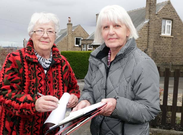 Lesley Lambourne (right) has the petition signed by Crosland Moor resident Shirley Landin. (Image: Andy Catchpool)