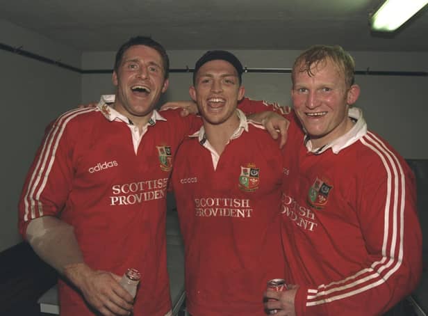 PARTY TIME: Alan Tait, left, Matt Dawson and Neil Jenkins celebrate the British Lions' first Test win over South Africa, winning 25-16 at Newlands in Cape Town in June 1997. Picture: GettyImages/Alex Livesey /Allsport