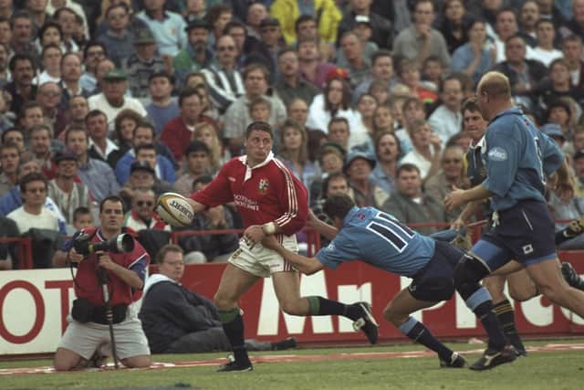 HOW OLD? Alan Tait is tackled by Casper Steyn of Northern Transvaal during the British Lions tour match in Pretoria in June 1997. Picture: Getty Images/Alex Livesey/Allsport