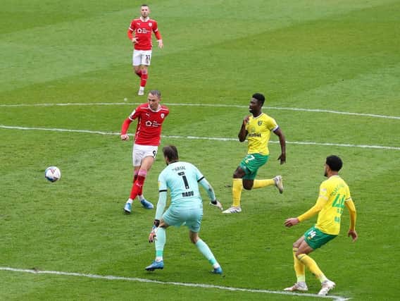 Cauley Woodrow fires Barnsley into the lead against Norwich City. Pictures: Getty Images