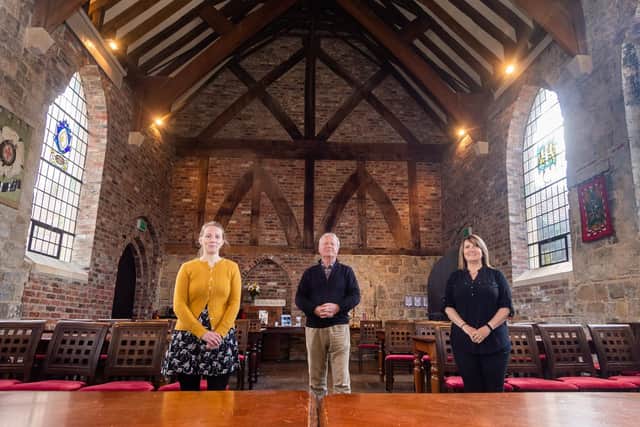 Pictured at Bedern Hall are Ella Voce, Heritage Development Office, Roger Lee, Operations Director, and Elly Richmond, Manager. Image: James Hardisty