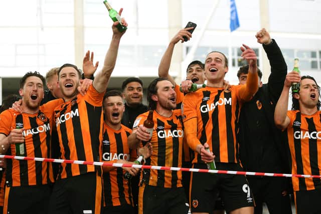 Hull's players run out of the KCOM Stadium to celebrate with their fans.
 (
Picture: Jonathan Gawthorpe)