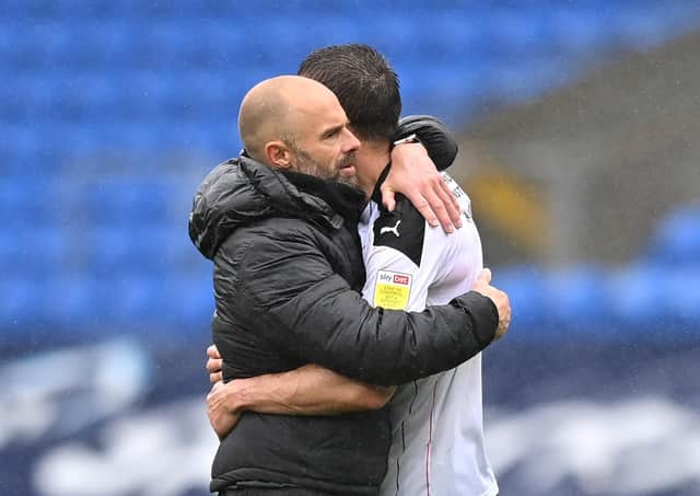 Consoling: Paul Warne embraces Richard Wood. Pictures: Getty Images.