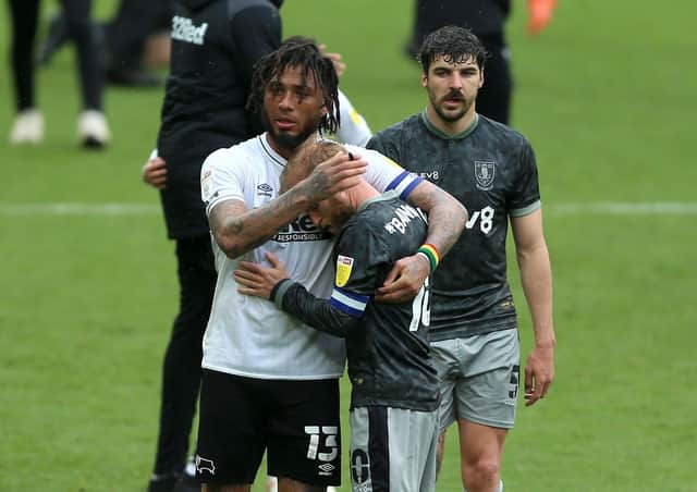 Bitter end: Sheffield Wednesday's Barry Bannan is consoled by Derby County's Colin Kazim-Richards. Picture: PA