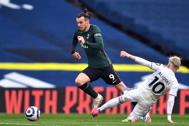 Rare advantage: Tottenham Hotspur's Gareth Bale finally skips past Leeds United's Ezgjan Alioski.