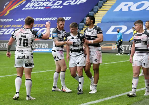 Hull FC's Connor Wynne (centre) celebrates against Wigan. Picture: PA