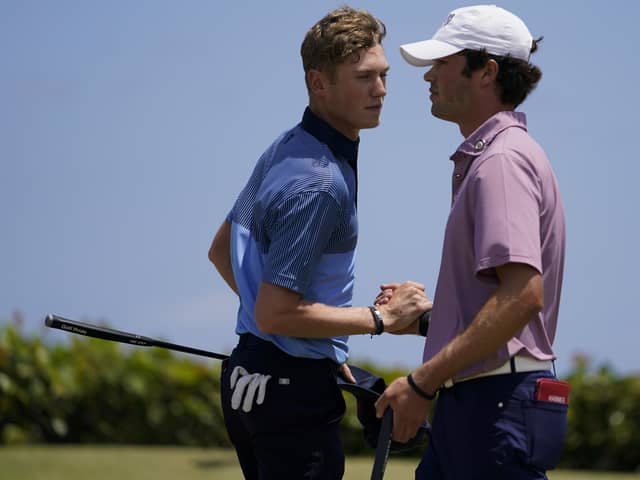 Friendly foes: Cole Hammer, right, of the USA team, greets Ben Schmidt. Pictures: AP Photo/Gerald Herbert