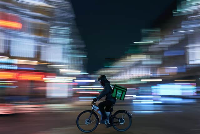 Library image of an Uber Eats delivery rider. Wendy’s will be partnering with Uber Eats to provide delivery options.