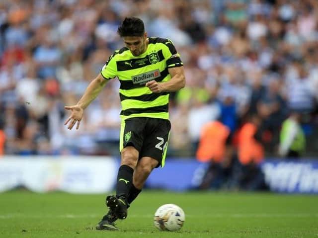 Huddersfield Town's Christopher Schindler scores the winning penalty to take the Terriers into the Premier League in May 2017. Picture: PA.