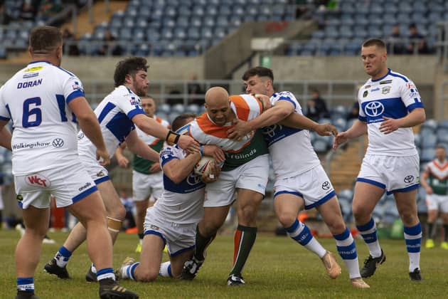 BACK AT IT: Hunslet's Alex Rowe takes some stopping by the Town's defence. Picture: Tony Johnson.