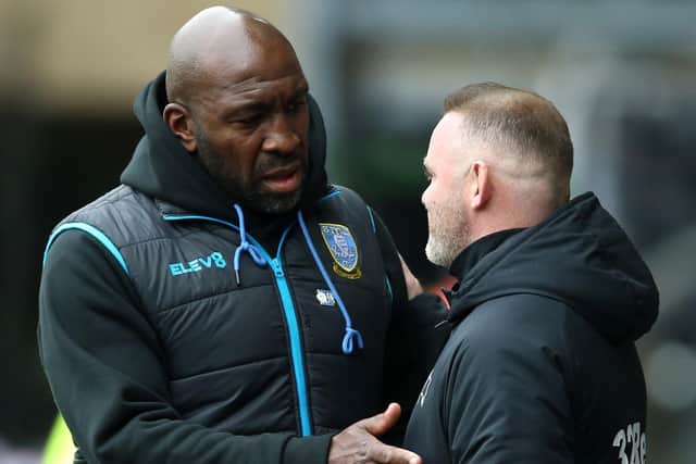 Final encounter: Sheffield Wednesday manager Darren Moore and Derby County manager Wayne Rooney before their showdown match.