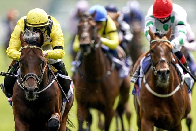 Ilaraab ridden by Tom Marquand (left) on their way to winning the Sky Bet Race To The Ebor Jorvik Handicap during day one of the Dante Festival at York Racecourse.