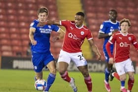 Barnsley's Victor Adeboyejo battles with Cardiff's Will Vaulks in their fixture at Oakwell in January. Picture Tony Johnson