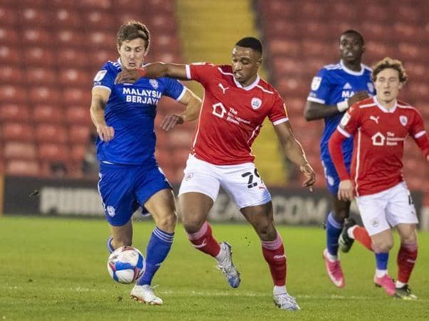 Barnsley's Victor Adeboyejo battles with Cardiff's Will Vaulks in their fixture at Oakwell in January. Picture Tony Johnson