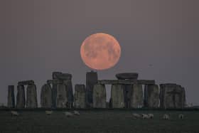 The full moon sets behind Stonehenge on April this year  in Amesbury, England. 
Photo credit: Finnbarr Webster/Getty Images