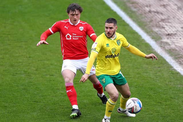 Debut: Liam Kitching challenges Norwich's  Emiliano Buendia. Picture: George Wood/Getty Images