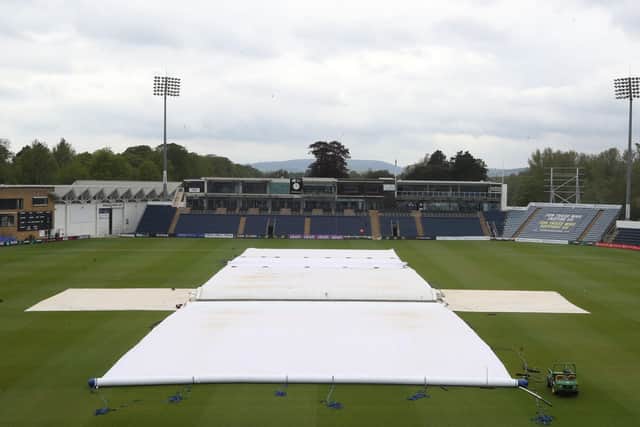 Covers protect the wicket from the rain during the morning session on day one of the LV = Insurance County Championship match at Sophia Gardens, Cardiff. Photo: Nick Potts/PA.