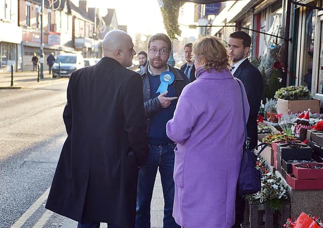 Alexander Stafford (centre) campaigning before the 2019 General Election with then Chancellor Sajid Javid.