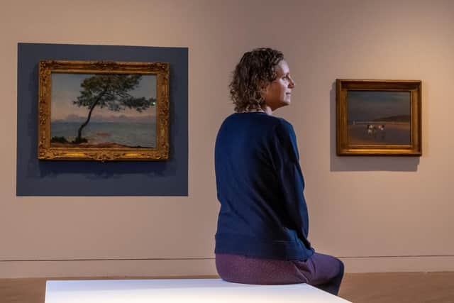 Ferens Art Gallery in Hull is to exhibit a painting by Impressionist Claud Monet as it reopens on Monday. Pictured Claire Longbrigg, exhibition officer, with the painting Antibes, 1888. Image by James Hardisty