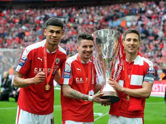 WEMBLEY MEMORIES: Ashley Fletcher, Adam Hammill and Conor Hourihane celebrate with the Football League Trophy when Barnsley played at the National stadium in 2016