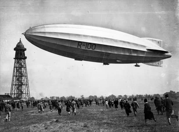 An enthusiastic crowd rushes to meet the  R-100, as she approaches her mooring tower at Cardington, Bedfordshire.   (Photo by Central Press/Getty Images)