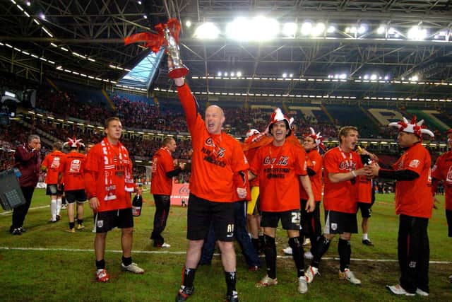 Going up: Barnsley manager Andy Ritchie celebrates winning the Coca-Cola League play off final against Swansea.