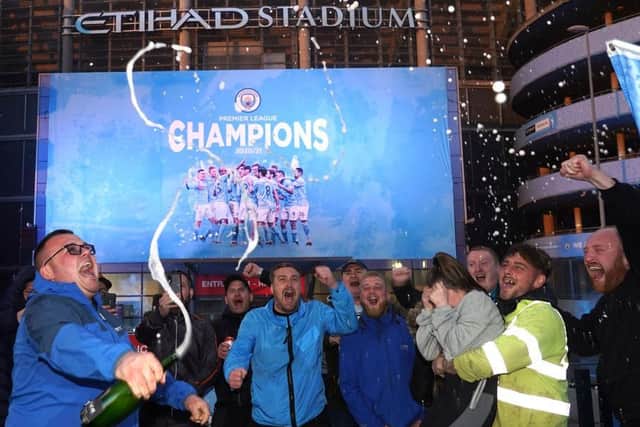 WINNERS: Manchester City fans celebrate their title win